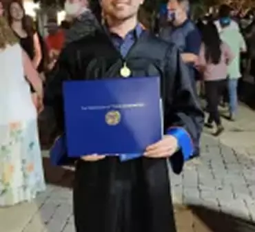 Austin at his UT Arlington graduation