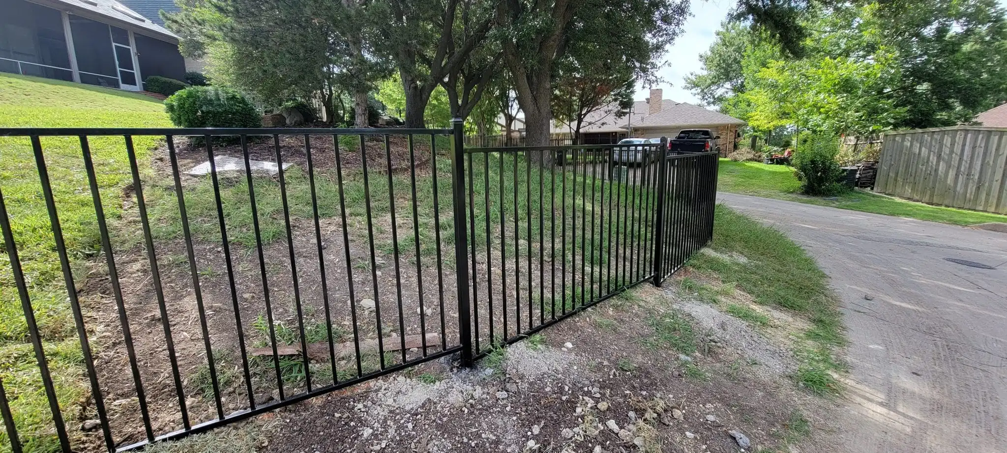 Black wrought iron style metal fence and gate in DFW, photo 3