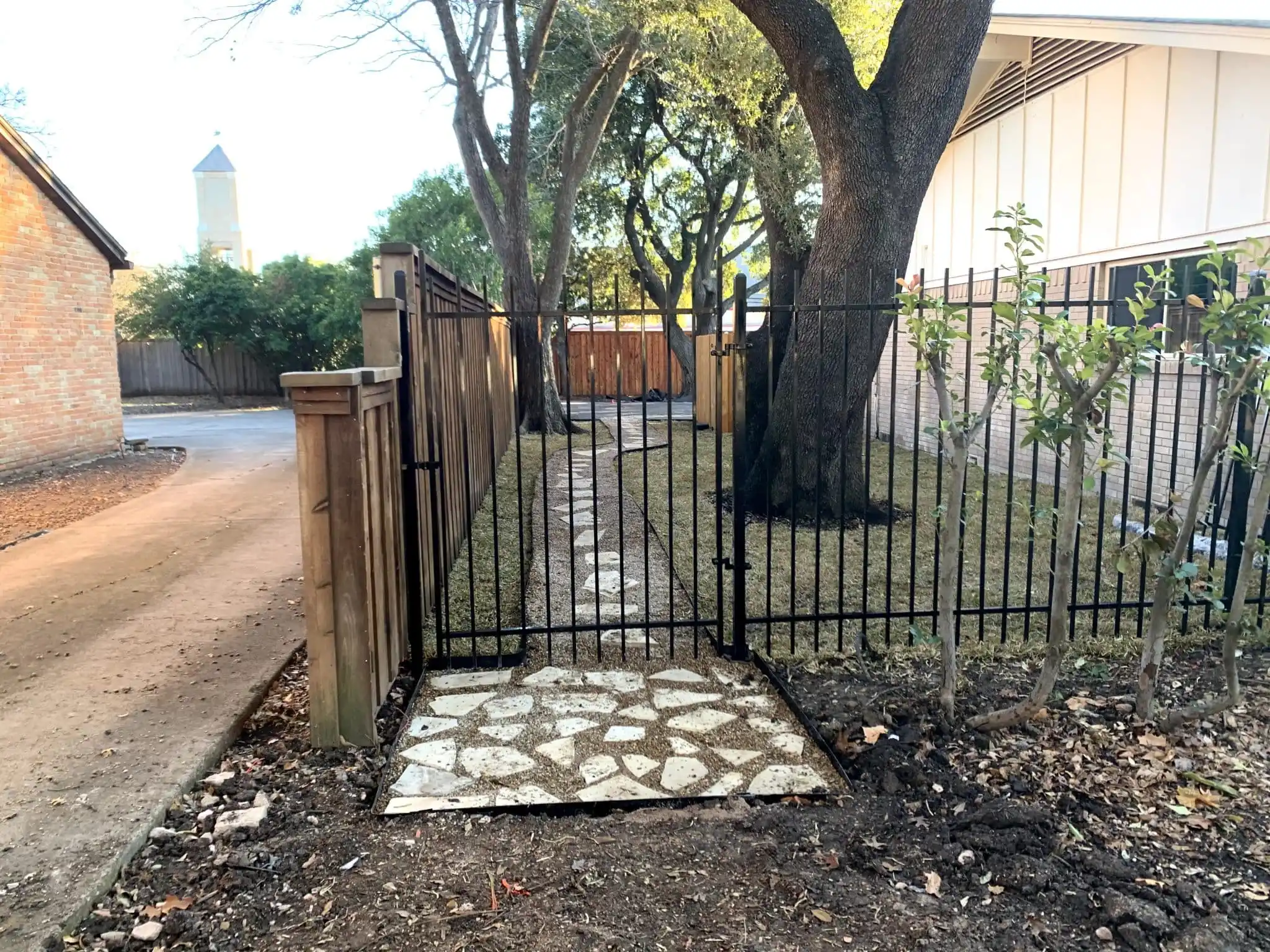 Black wrought iron style metal fence and gate in DFW, photo 8