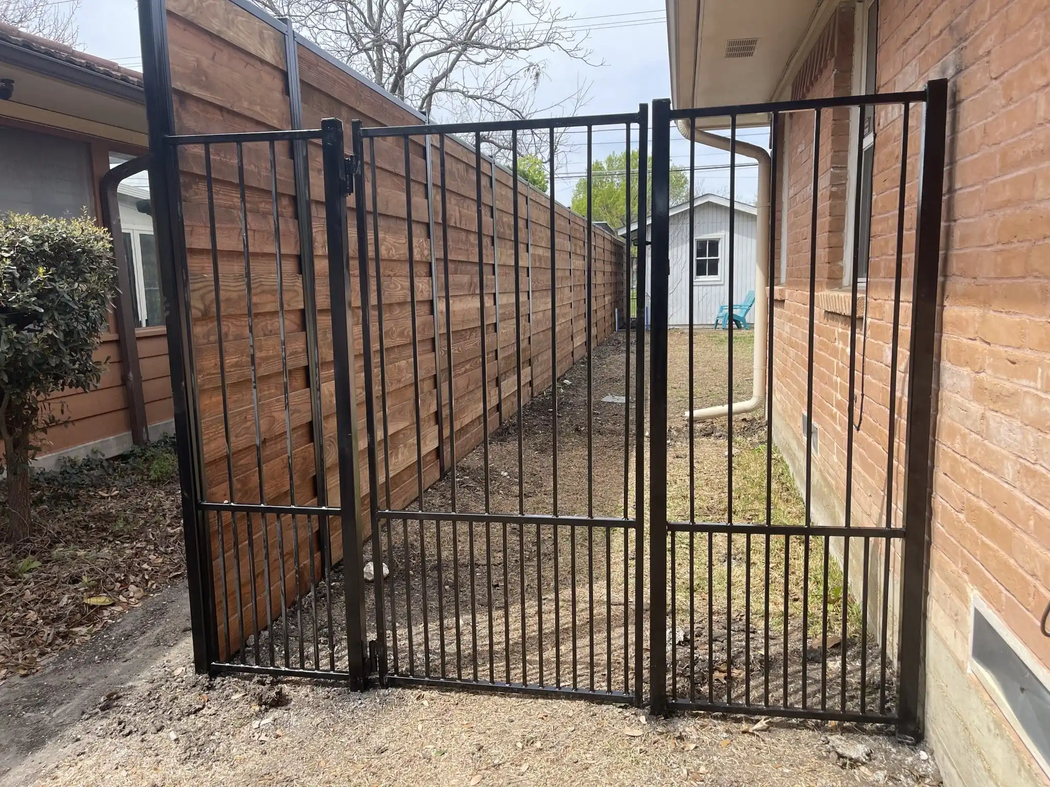 Black wrought iron style metal fence and gate in DFW, photo 6