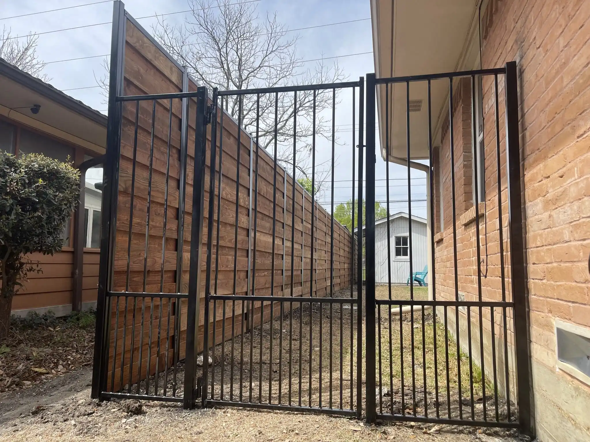 Black wrought iron style metal fence and gate in DFW, photo 7
