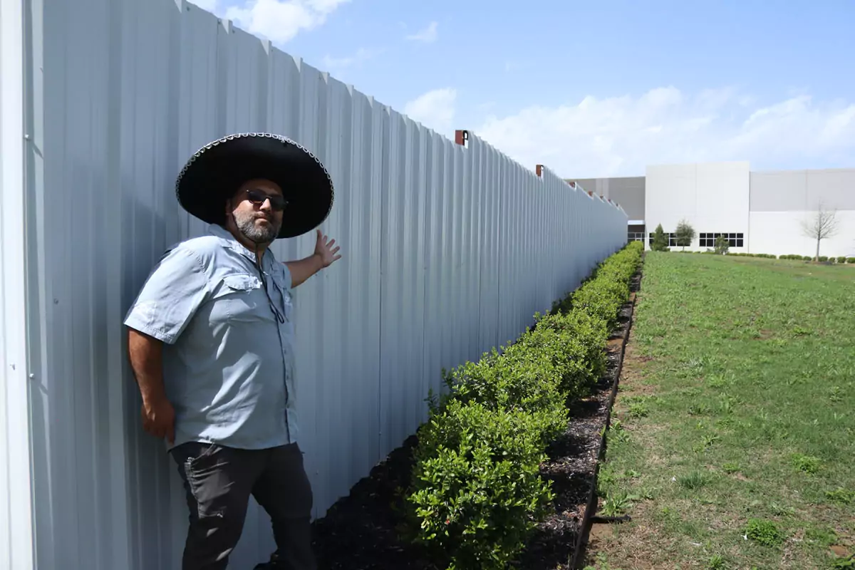 Sheet metal R panel privacy fence in DFW by Jalapeno Fence Co.