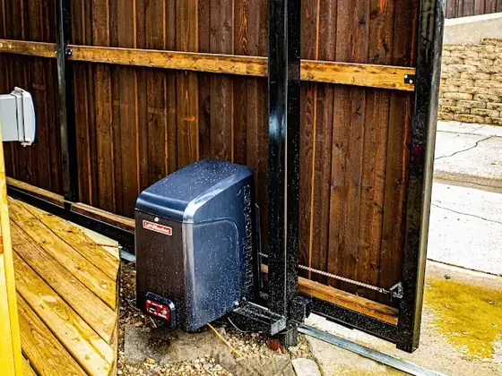 Automatic sliding wood drive gate by Jalapeno Fence Co.
