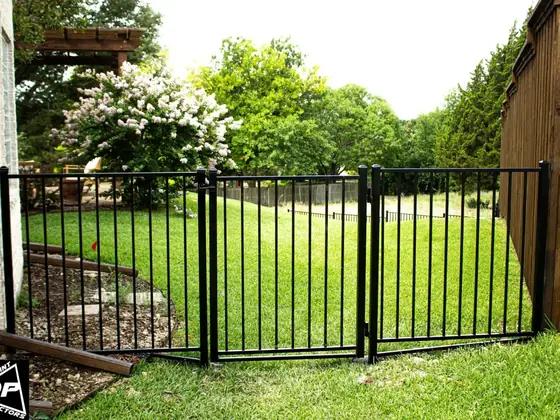 Black wrought iron fence by Jalapeno Fence Co.