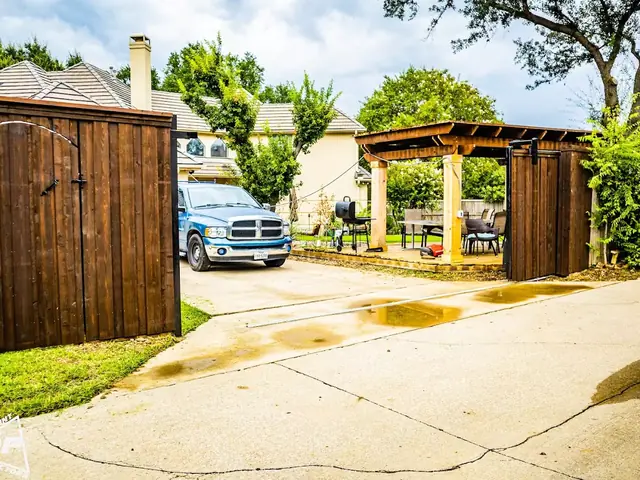 Cedar fence with sliding drive gate