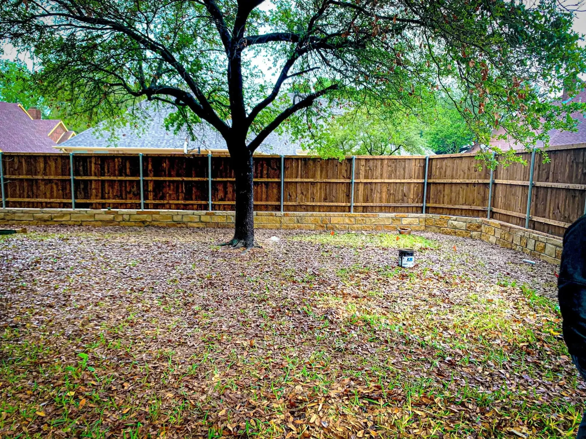 Cedar fence built on top of a stone retaining wall in DFW, photo 3