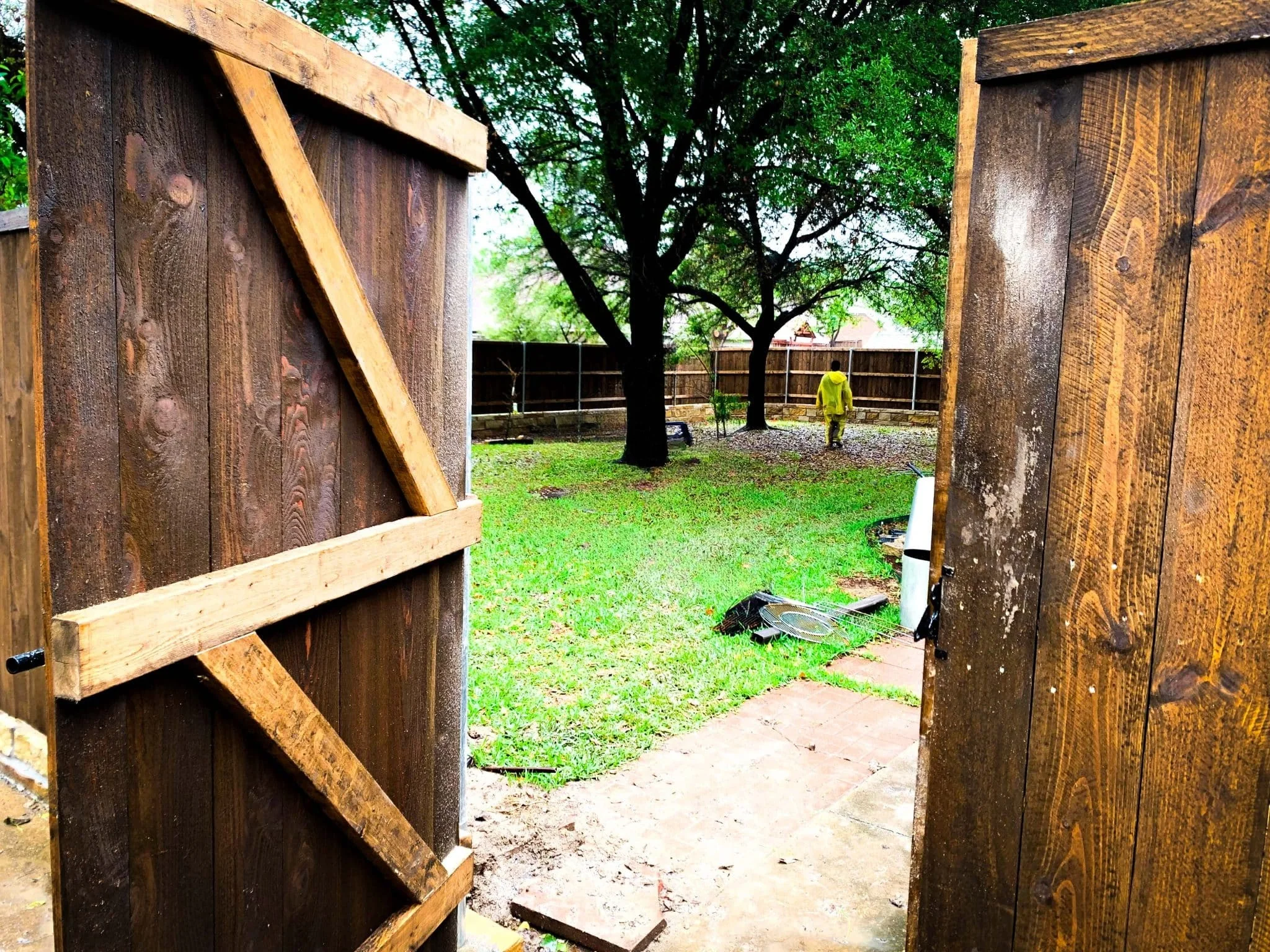 Cedar fence built on top of a stone retaining wall in DFW, photo 5