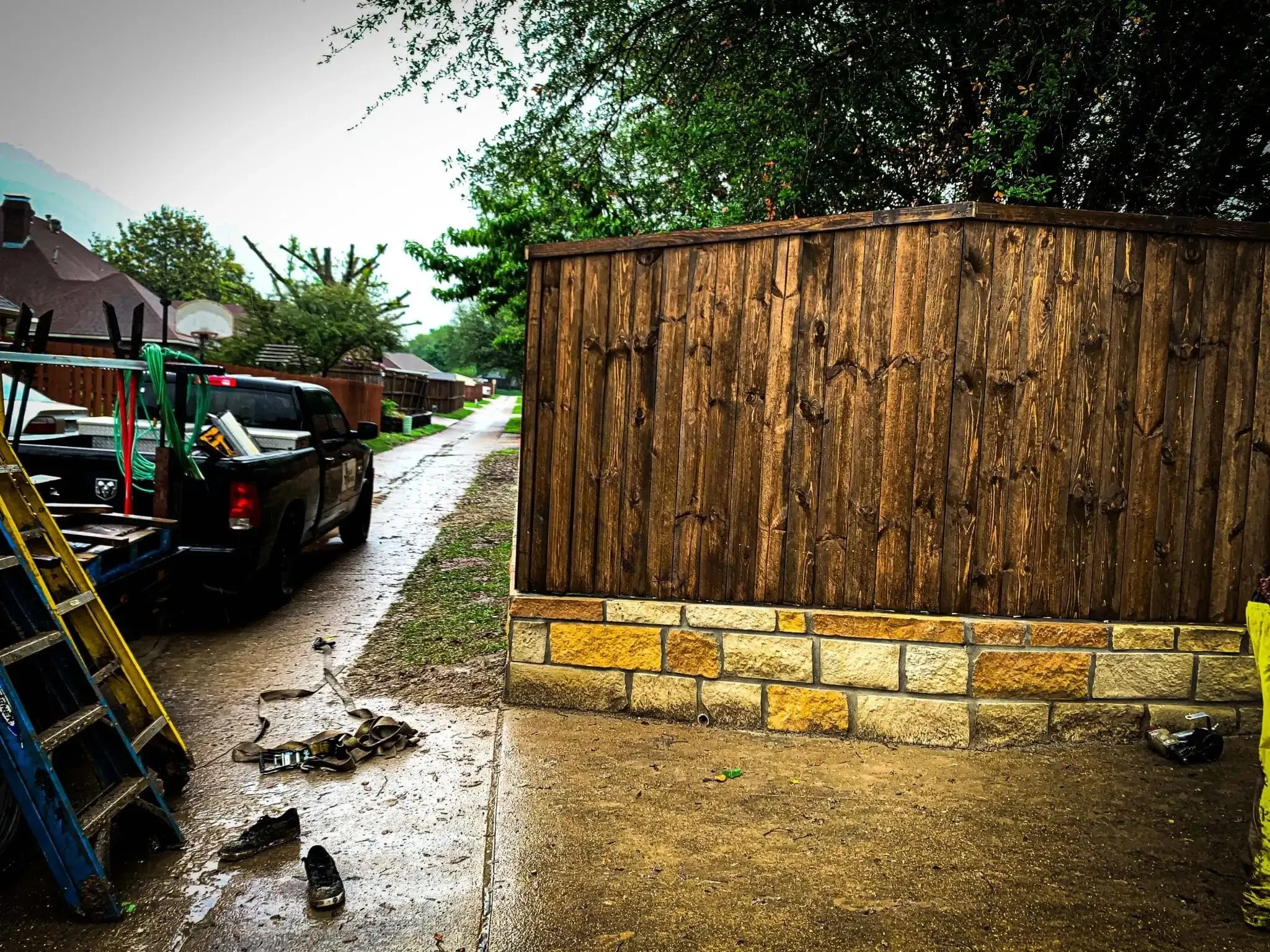 Cedar fence built on top of a stone retaining wall in DFW, photo 14